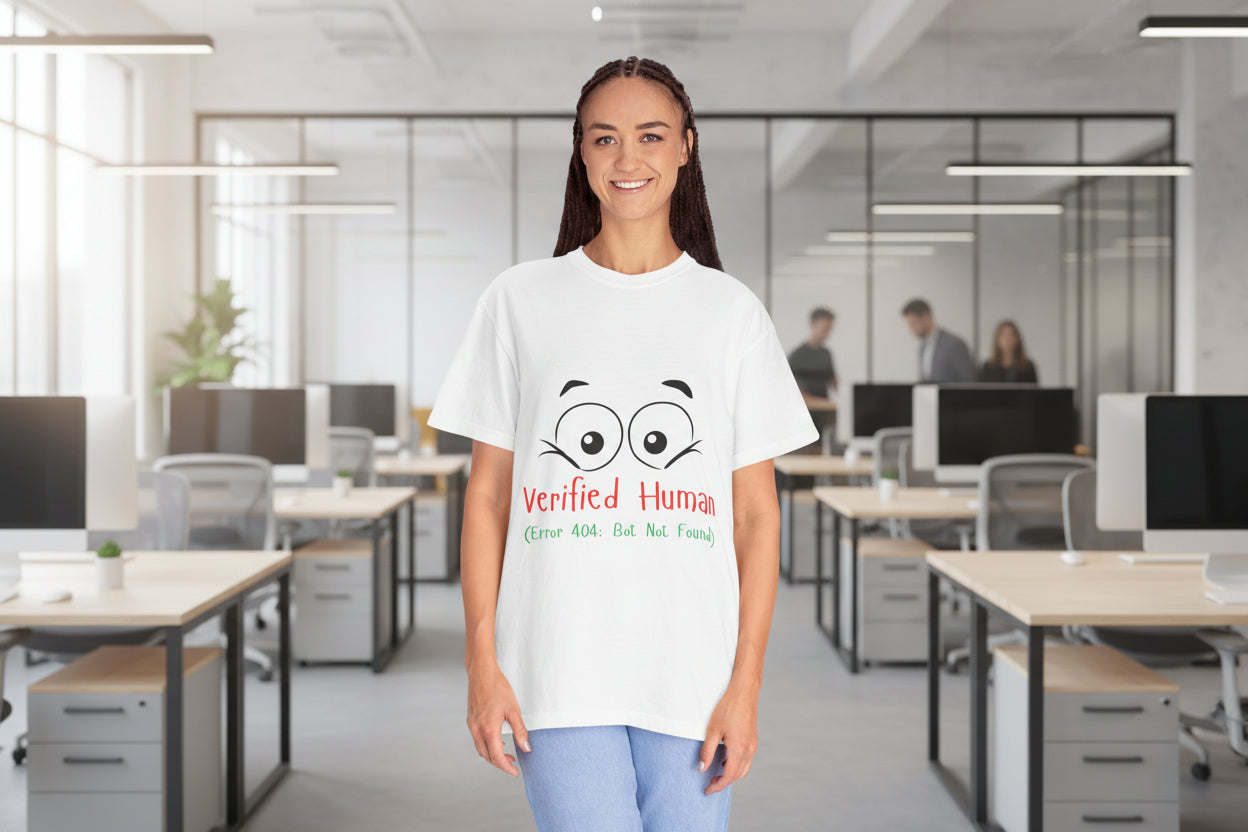Person wearing a white t-shirt with cartoon eyes and text on a white background