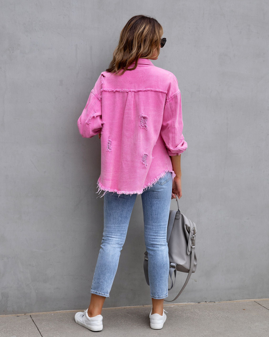 Women's pink ripped denim-style shirt jacket with distressed details, casual ladies fashion outerwear 