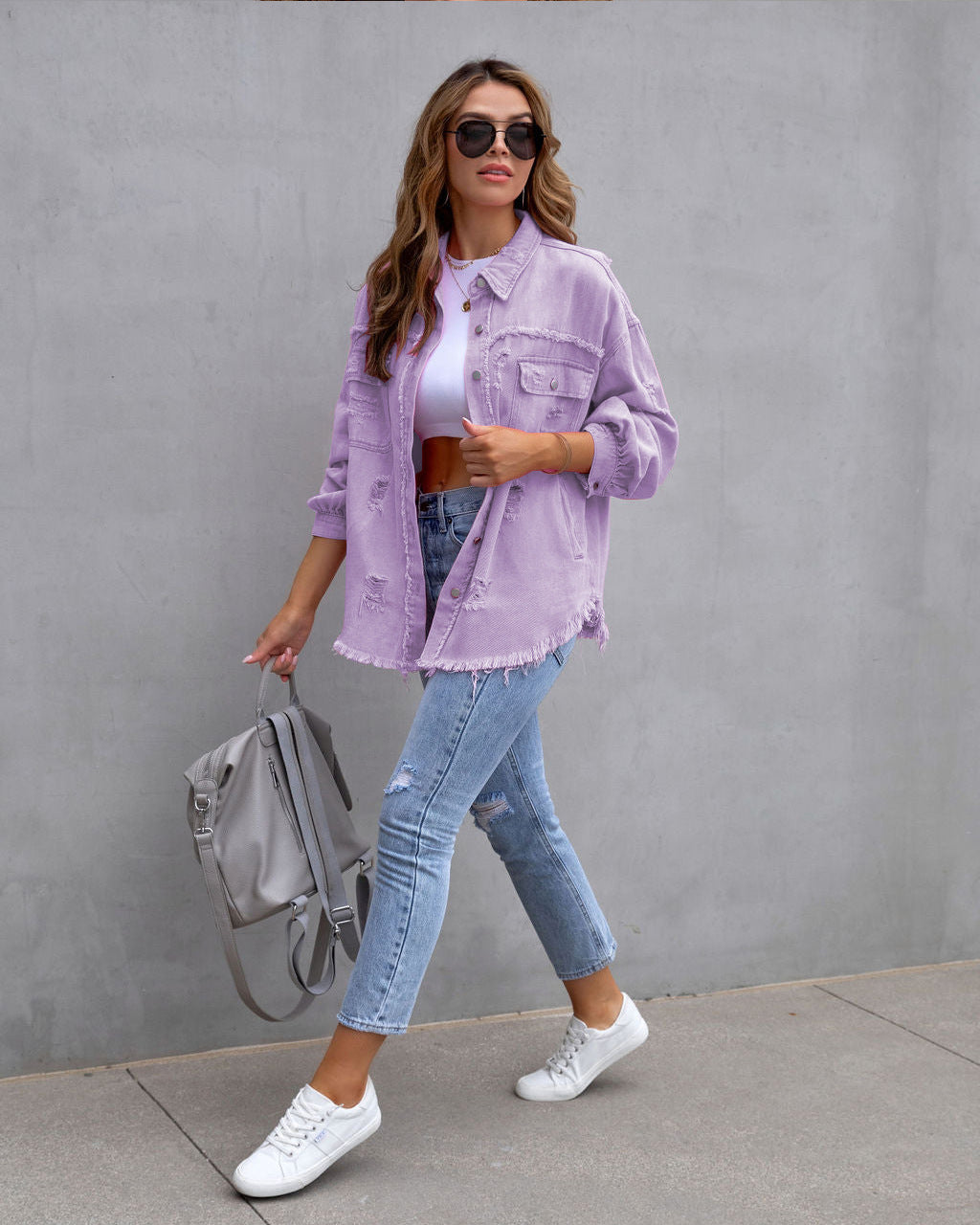 Purple ripped denim-style women's shirt jacket, featuring distressed details and casual style.
