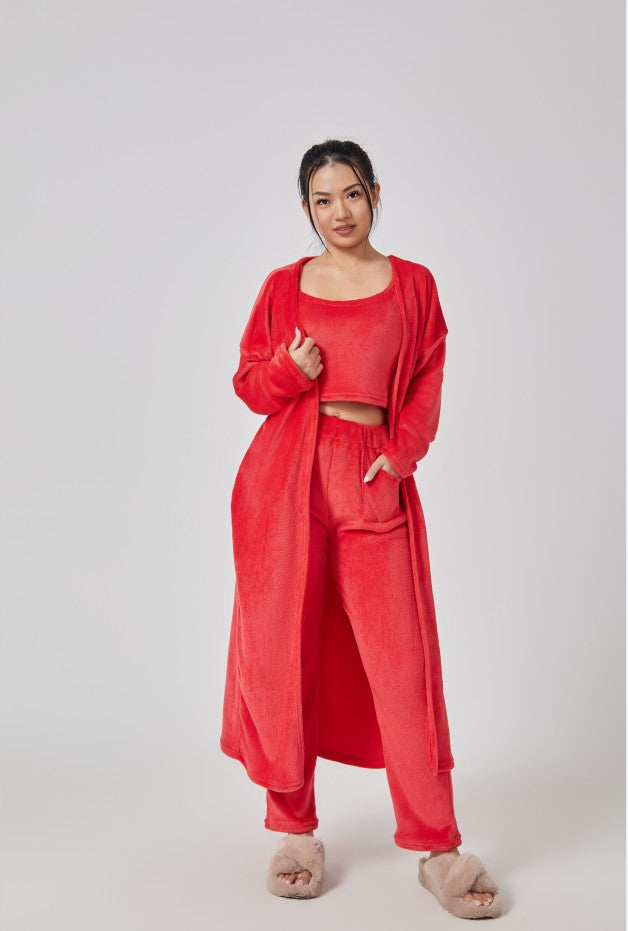 Woman wearing a red outfit on a white background