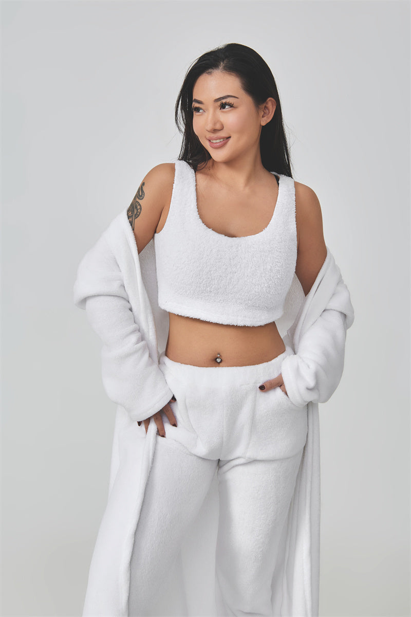 Woman wearing a white outfit with a plain background