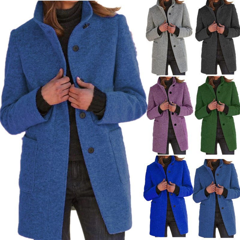 Black Sovereign stand-collar woolen coat for fall and winter, displayed with stylish bags in a modern fashion setting.